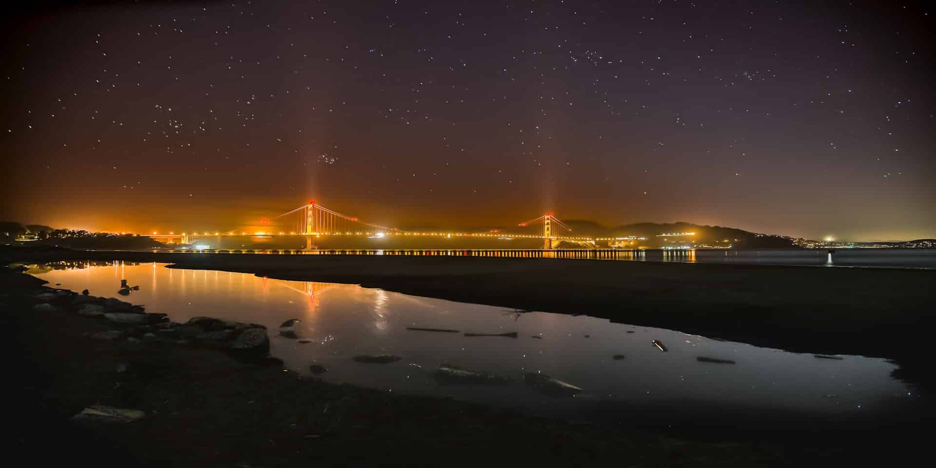 Night view of the Golden Gate Bridge from Crissy Field East Beach in San Francisco